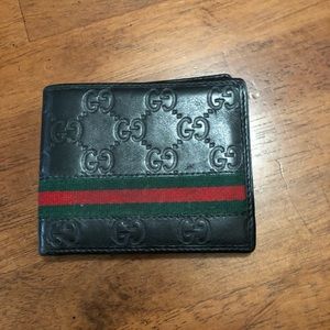 Gucci embossed bifold leather wallet